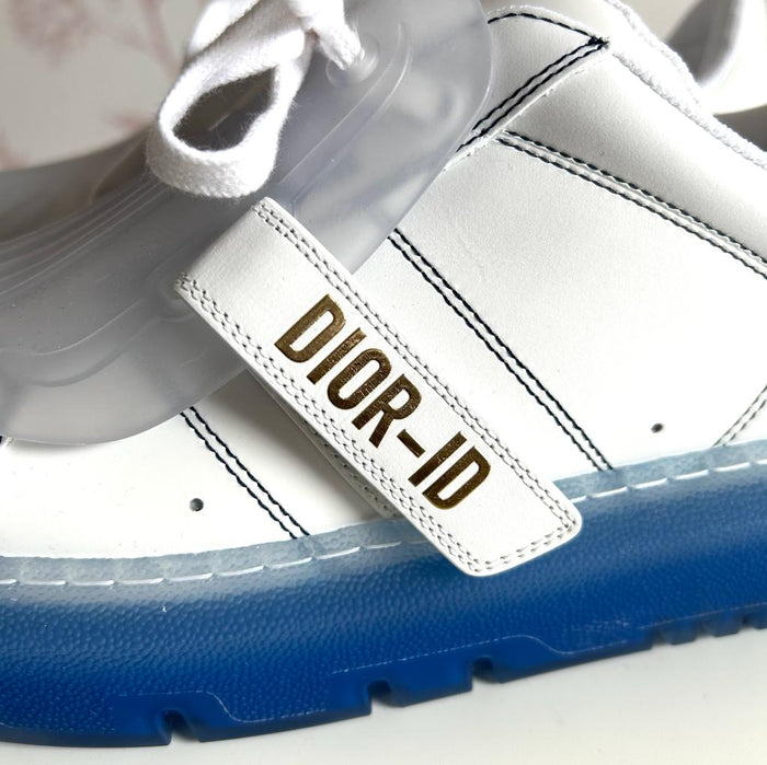 White and Blue Sneakers with Velcro Strap.  (close up)