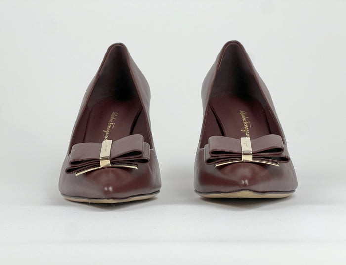 Excellent Pre-Loved Burgundy Smooth Leather Double Bow Point Toe Heels with Light Gold Tone Hardware.(front)
