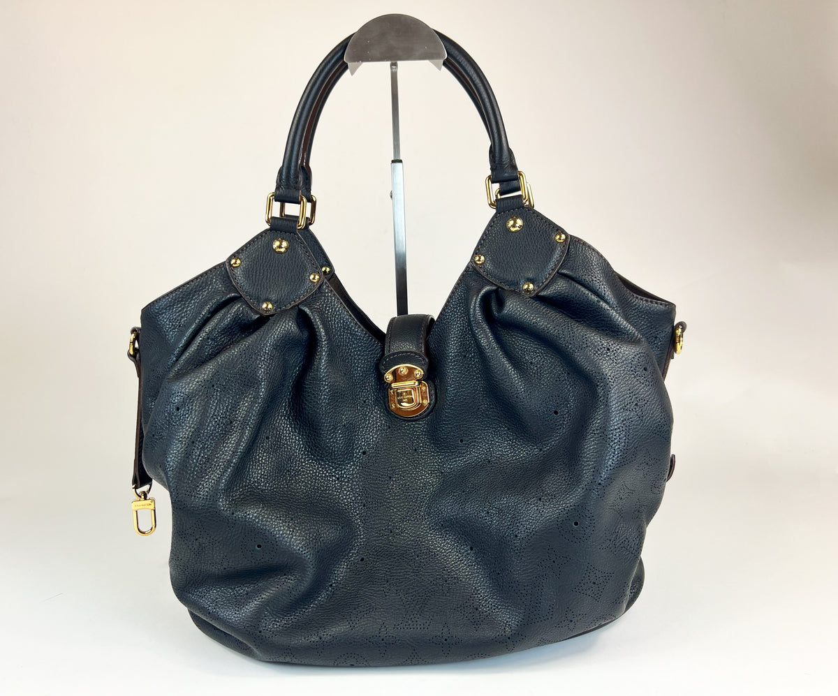Excellent Pre-Loved Black Grained Leather with Perforated Monogram Pattern Large Tote Bag. (front)