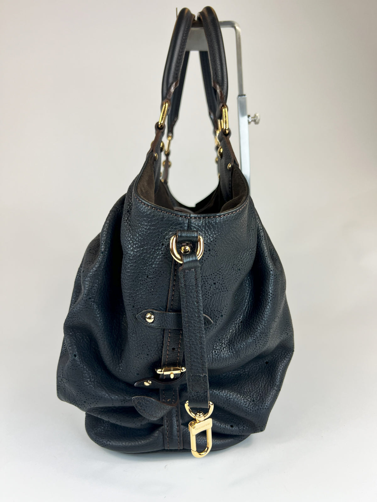 Excellent Pre-Loved Black Grained Leather with Perforated Monogram Pattern Large Tote Bag.(side)