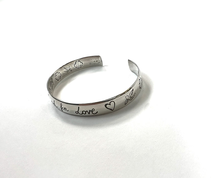 Pre-Loved Silver Tone 'Blind For Love' Engraved Open Bracelet.(close up)