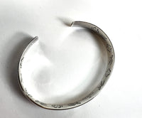 Pre-Loved Silver Tone 'Blind For Love' Engraved Open Bracelet.(top)