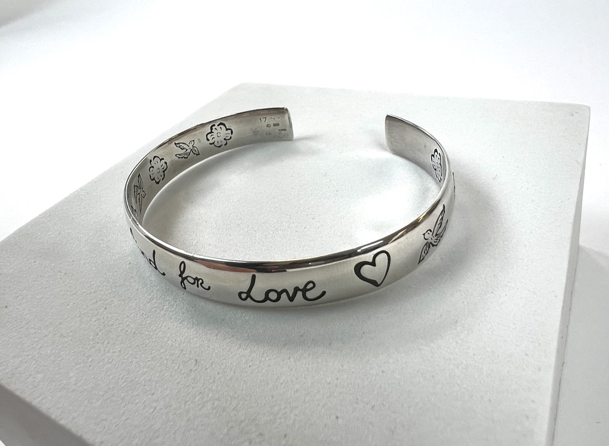 Pre-Loved Silver Tone 'Blind For Love' Engraved Open Bracelet.(close up)