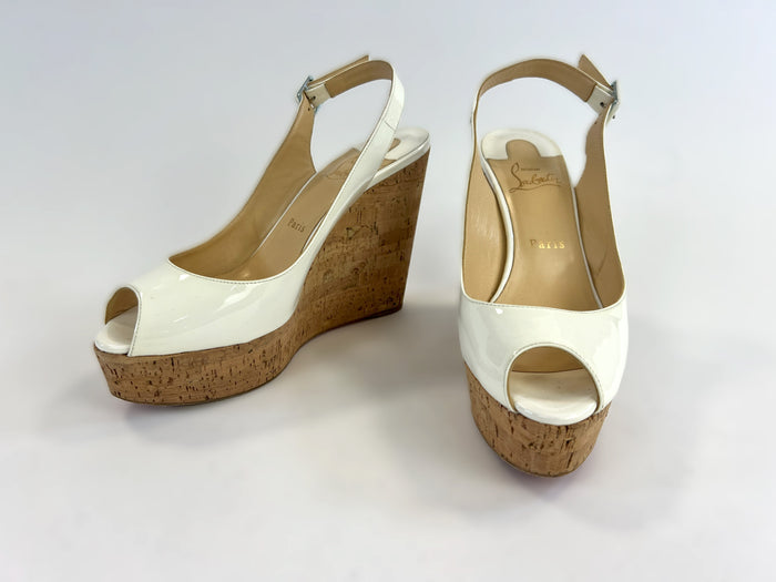 Pre-Loved White Patent Leather Peep Toe Open Back Cork Wedge Sandals with Ankle Strap. (front)