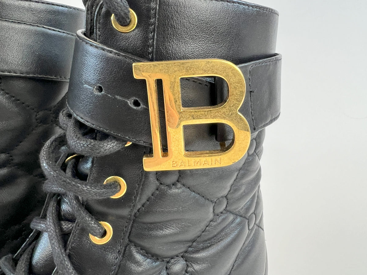 Pre-Loved Black Quilted Leather with Gold Tone Logo/Hardware Lace Up Combat Boots. (close up)