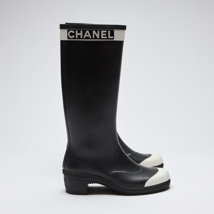 Excellent Pre-Loved Black Rubber Tall Rain Boots with White Toe Cap and Logo Trim at Top.(side)