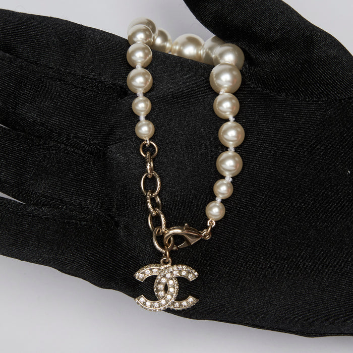 Excellent Pre-Loved Faux Pearl Bracelet with Crystal Embellished Logo Charm. (in hand)