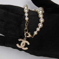Excellent Pre-Loved Faux Pearl Bracelet with Crystal Embellished Logo Charm. (logo)