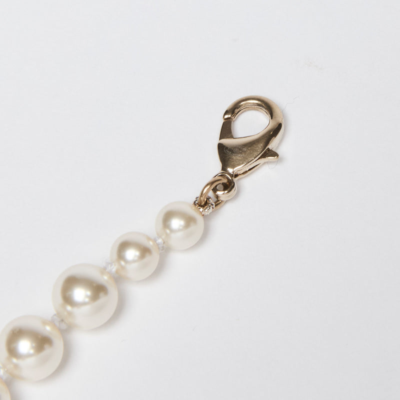 Excellent Pre-Loved Faux Pearl Bracelet with Crystal Embellished Logo Charm. (clasp)