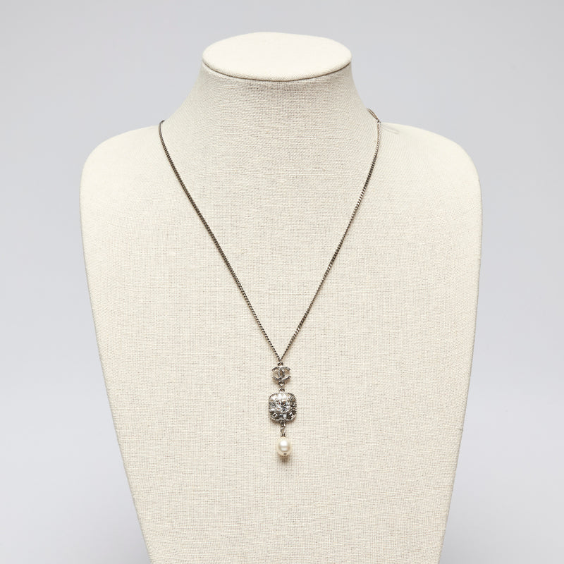 Pre-Loved Chanel™ Silver Tone Necklace with Crystal Embellished Square Pendant and Pearl Drop.