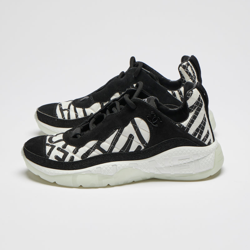 Excellent Pre-Loved Black and White Nylon Quilted Sneakers with Suede Details and Graffiti Logo Print. (side)