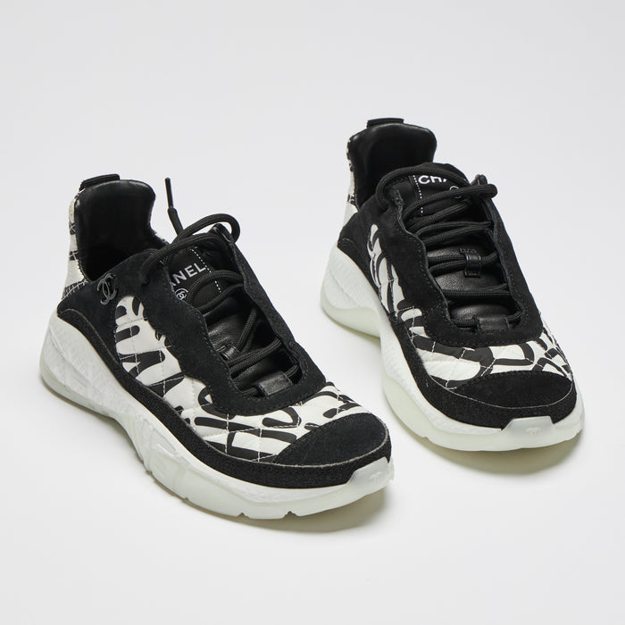 Excellent Pre-Loved Black and White Nylon Quilted Sneakers with Suede Details and Graffiti Logo Print. (front)