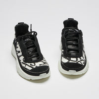 Excellent Pre-Loved Black and White Nylon Quilted Sneakers with Suede Details and Graffiti Logo Print.(front)