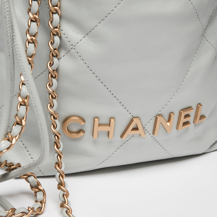 Pre-Loved Chanel ™ Blue Lambskin Mini 22 Bag with Gold Hardware