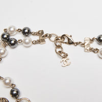 Pre-Loved Chanel™ Multistrand White/Grey Faux Pearl Necklace With Letter Logo Cutout Detail