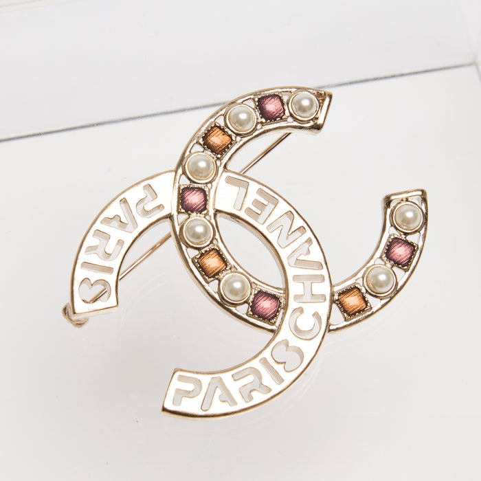 Pre-Loved Chanel ™ Gold CC Brooch with Embellishments and Logo Cutout