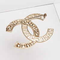 Pre-Loved Chanel ™ Gold CC Brooch with Embellishments and Logo Cutout