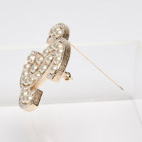 Pre-Loved Chanel ™ Gold Brooch with Pearls