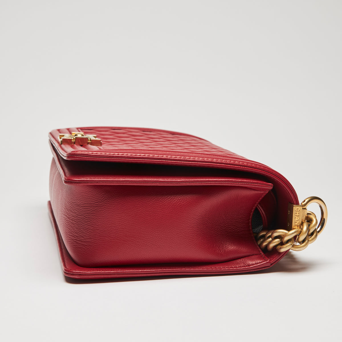 Excellent Pre-Loved Large Red Grained Calfskin Leather Structured Flap Bag with Aged Gold Hardware and Shoulder Chain. (side)