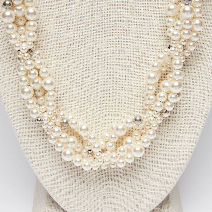 Excellent Pre-Loved Pearl Twist Long Necklace with Silver Tone Crystal Embellished Logo.(close up)
