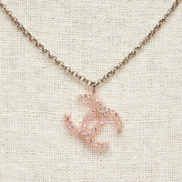 Excellent Pre-Loved Multicolor Crystal Embellished Light Pink Resin Logo Pendant Silver Tone Chain Necklace.(close up)