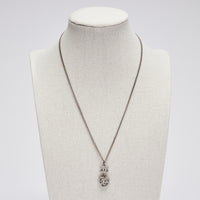 Excellent Pre-Loved Silver Tone Necklace with Crystal Embellished Logo and Camellia Drop Pendant.(front)