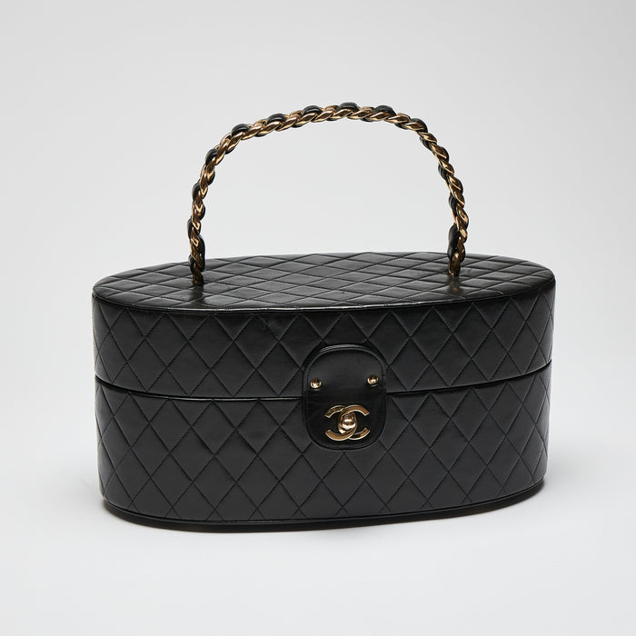 Pre-Loved Black Quilted Leather Oval Top Handle Vanity Case. (front)