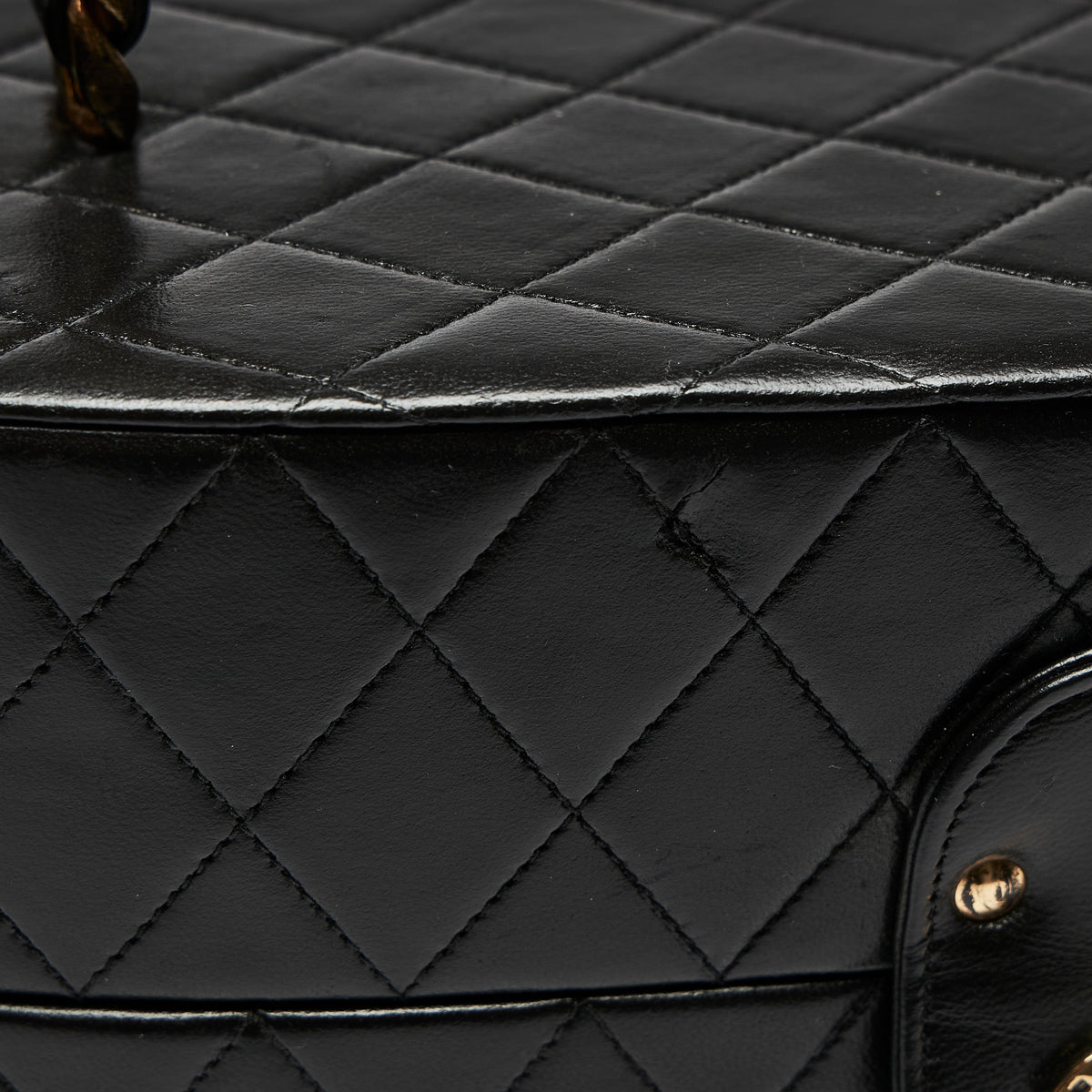 Pre-Loved Black Quilted Leather Oval Top Handle Vanity Case. (cut)