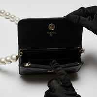 Excellent Pre-Loved Black Lambskin Quilted Leather Mini Bag with Oversized Faux Pearl Shoulder Strap. (interior)
