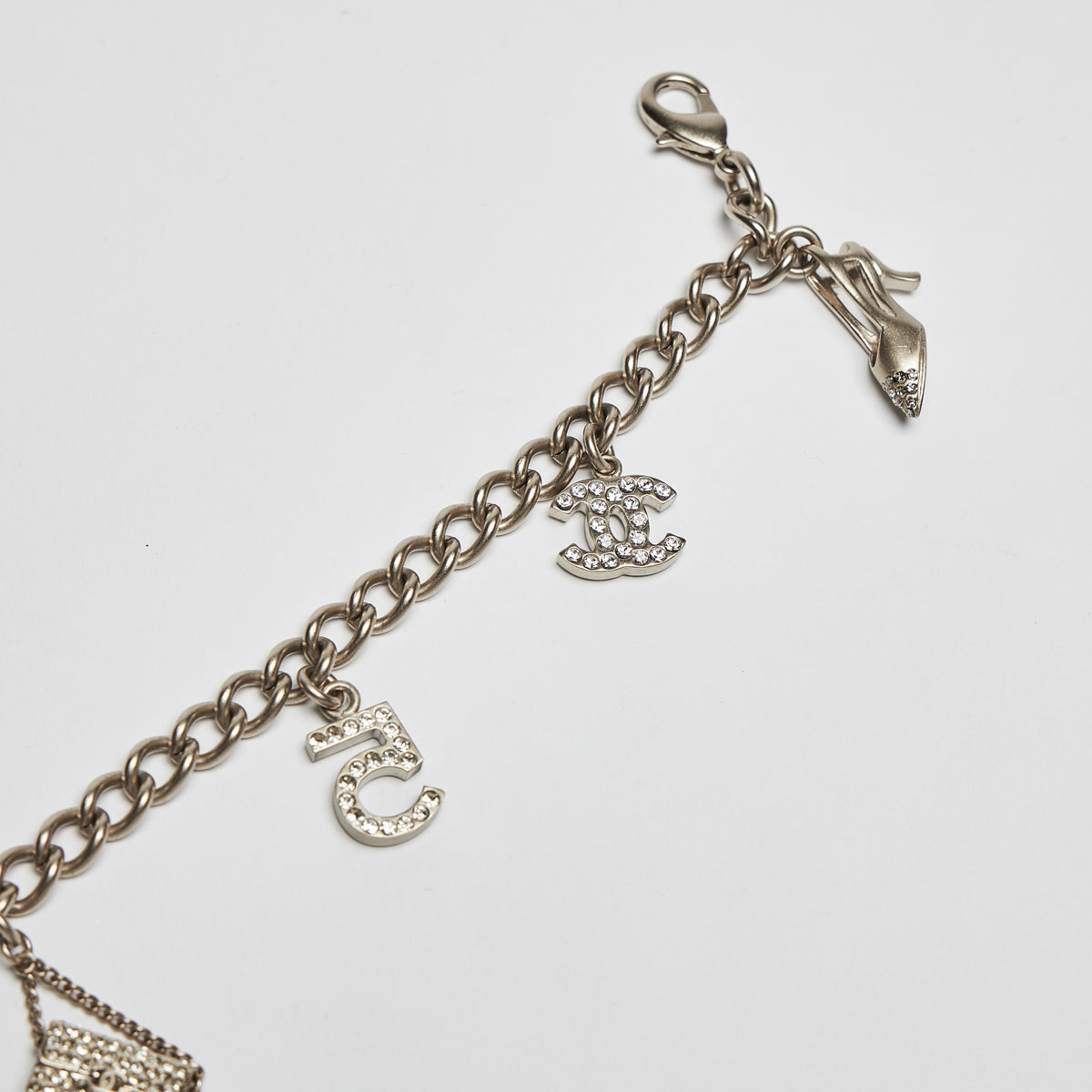 Excellent Pre-Loved Aged Champagne Gold Tone Chain Bracelet with Crystal Embellished iconic Charms.(charms)