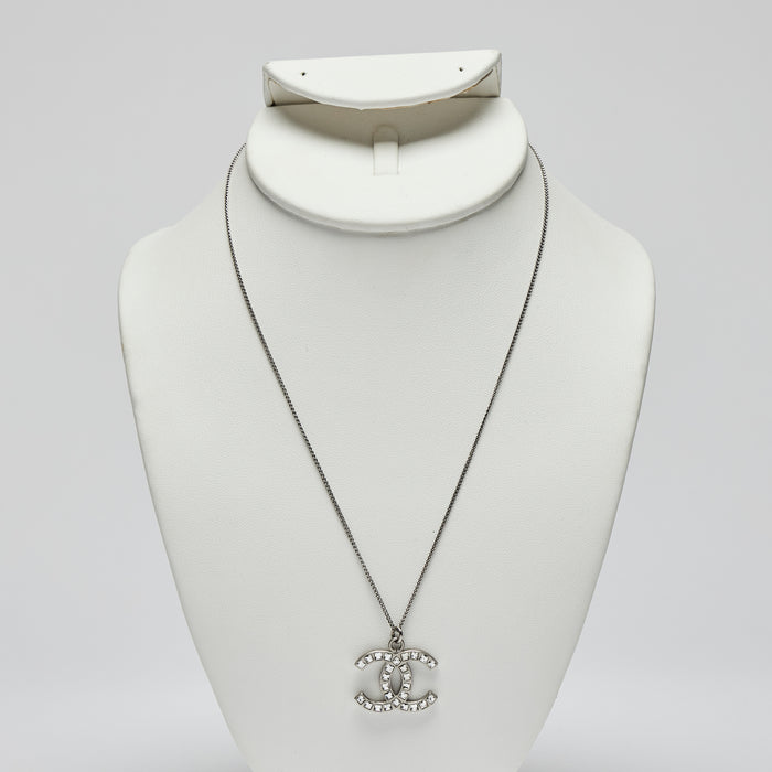 Excellent Pre-Loved Silver Tone Logo Pendant Necklace with Square Crystals Embellishment.(Front)