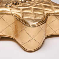 Pre-Loved Chanel™ Metallic Gold Star Purse (Collectors) (Side)