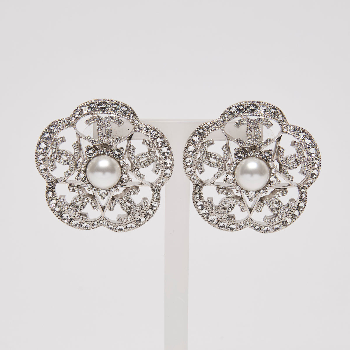 Pre-Loved Chanel™ Pearl & Strath Silver Metal Camellia Rhinestone Earrings(front)