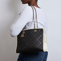 Pre-Loved Black and White Quilted Soft Leather Tote Bag. (on body) 