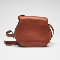 Excellent Pre-Loved Brown Leather Round Base Flap Bag with Tassel. (back)