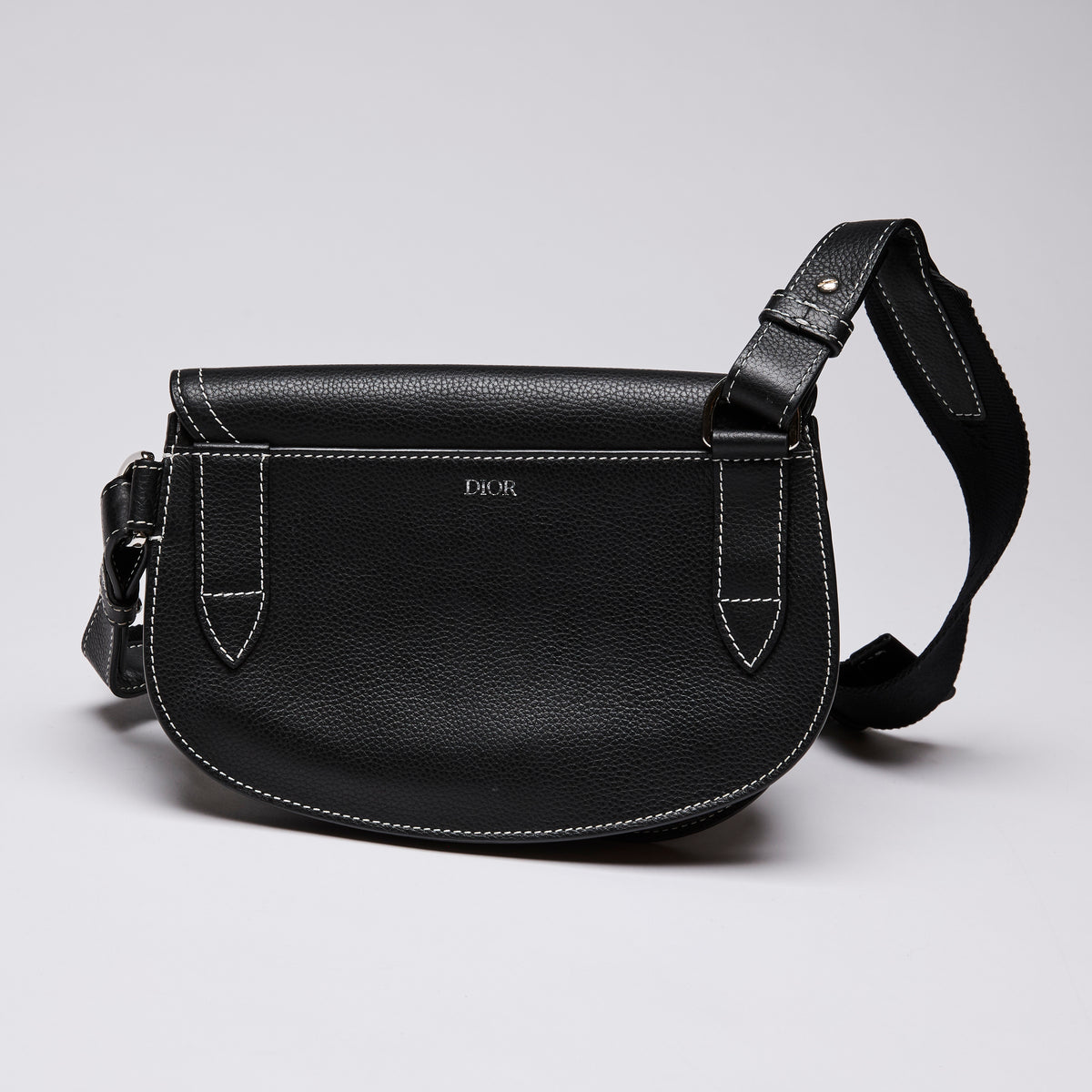 Dior X KAWS Small Black Pebbled Leather Saddle Bag with White Stitching Detail