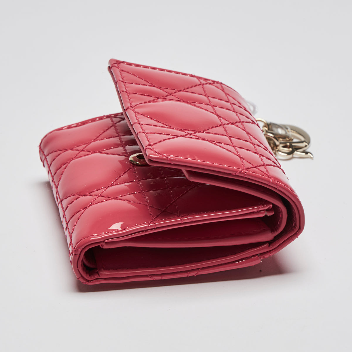 Excellent Pre-Loved Pink and Blue Patent Leather Cannage Motif Trifold Compact Wallets. (side pink)