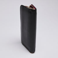 Pre-Loved Black Grained Leather Zip Around Long Wallet. (spine)
