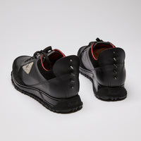 Excellent Pre-Loved Black Leather and Suede Monster Collection Lace Up Sneakers. (back)