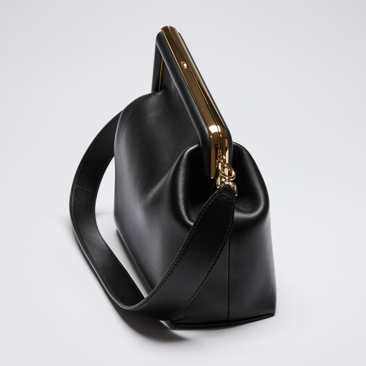 Excellent Pre-Loved Black Smooth Leather Asymmetrical Clutch Bag.(side)
