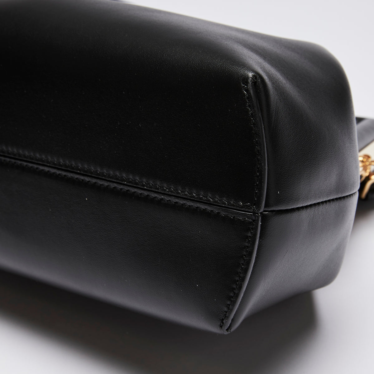 Excellent Pre-Loved Black Smooth Leather Asymmetrical Clutch Bag.(corner)