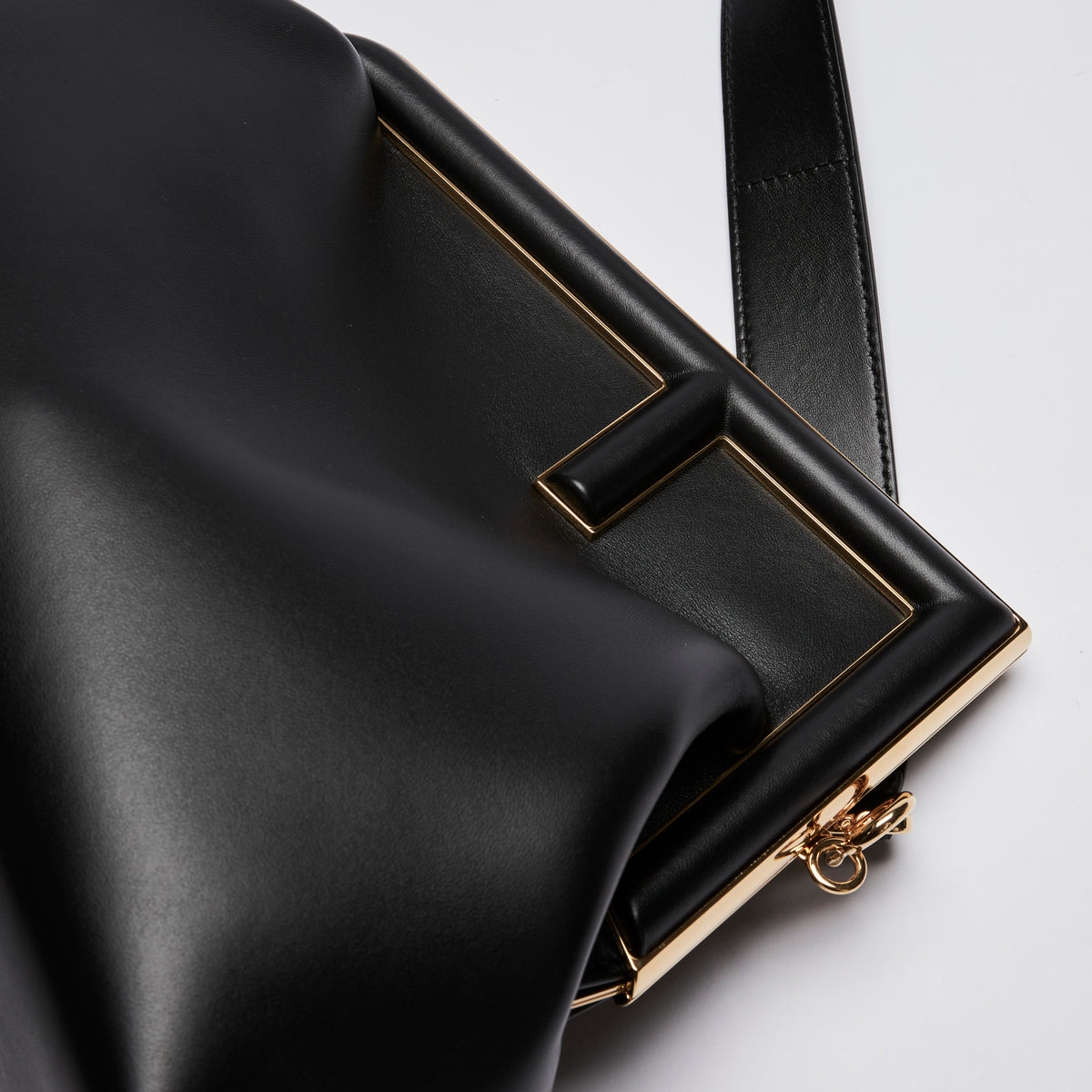 Excellent Pre-Loved Black Smooth Leather Asymmetrical Clutch Bag.(close up)