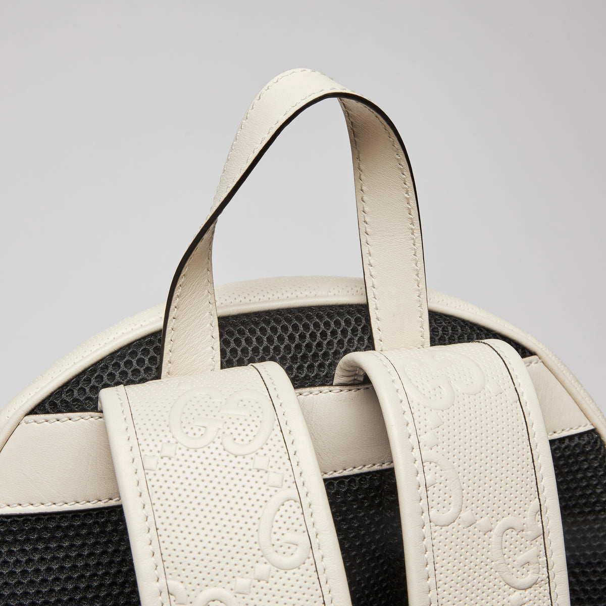 Excellent Pre-Loved White Logo and Diamond Patterned Perforated Leather Back Pack.(close up)