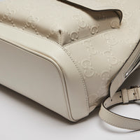 Excellent Pre-Loved White Logo and Diamond Patterned Perforated Leather Back Pack. (corner)