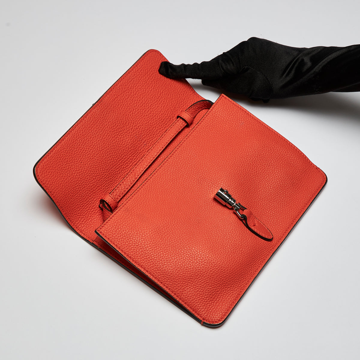 Excellent Pre-Loved Orange Pebbled Soft Leather Thin Crossbody Pouch with Removable Shoulder Strap and Silver Tone Hardware. (flap)