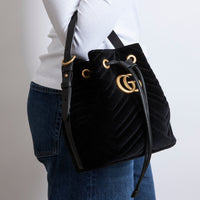 Excellent Pre-Loved Black Velvet Bucket Bag with Adjustable Top Handle and Removable Shoulder Chain.  (on body)