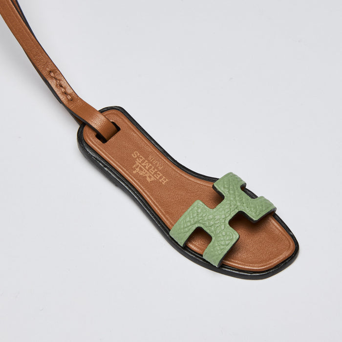 Excellent Pre-Loved Brown Leather and Green Textured Leather Oran Sandal Shaped Bag Charm. (details)