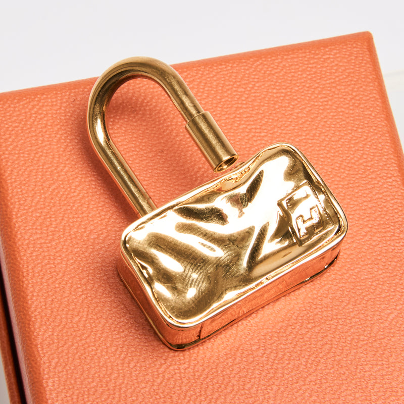 Hermes "Cadena" Padlock Trunk Bag Charms. Sold Separately