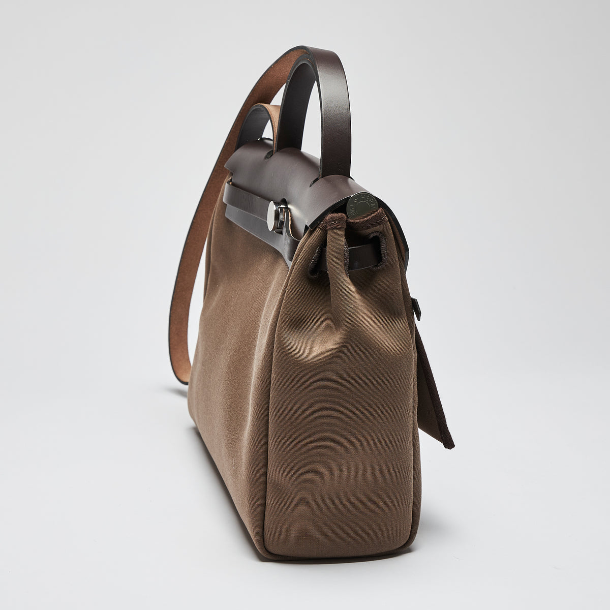 Excellent Pre-Loved Brown Canvas Top Handle Flap Bag with Shoulder Strap. (side)
