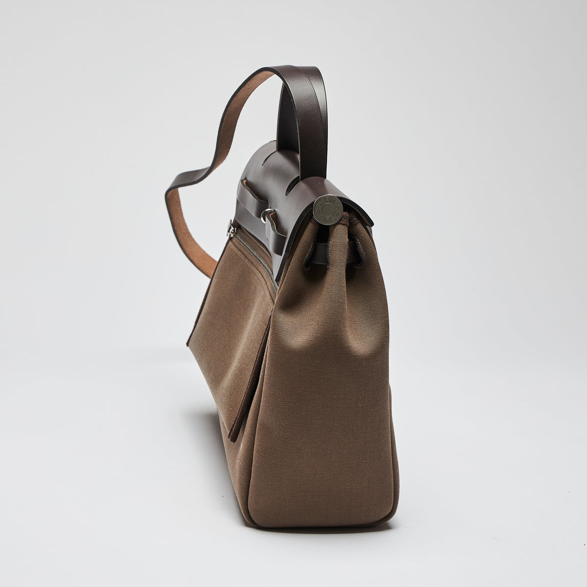 Excellent Pre-Loved Brown Canvas Top Handle Flap Bag with Shoulder Strap. (side)